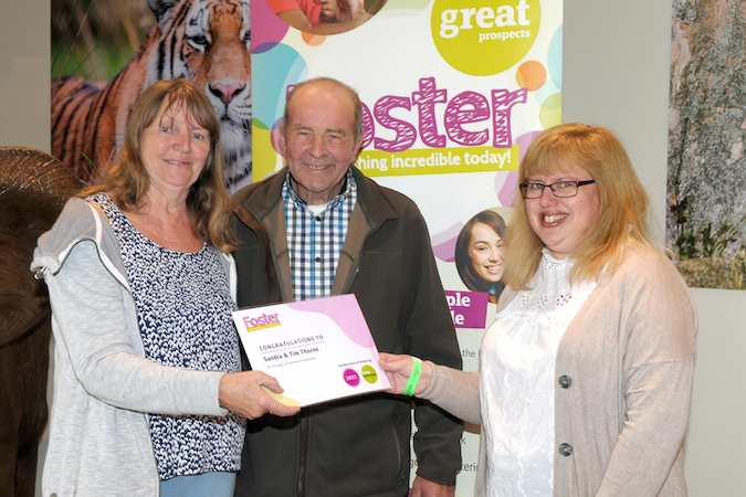 From left to right, Sandra and Tim Thorne receiving their 35 years of fostering award, presented by (right) Councillor Amanda Dodwell